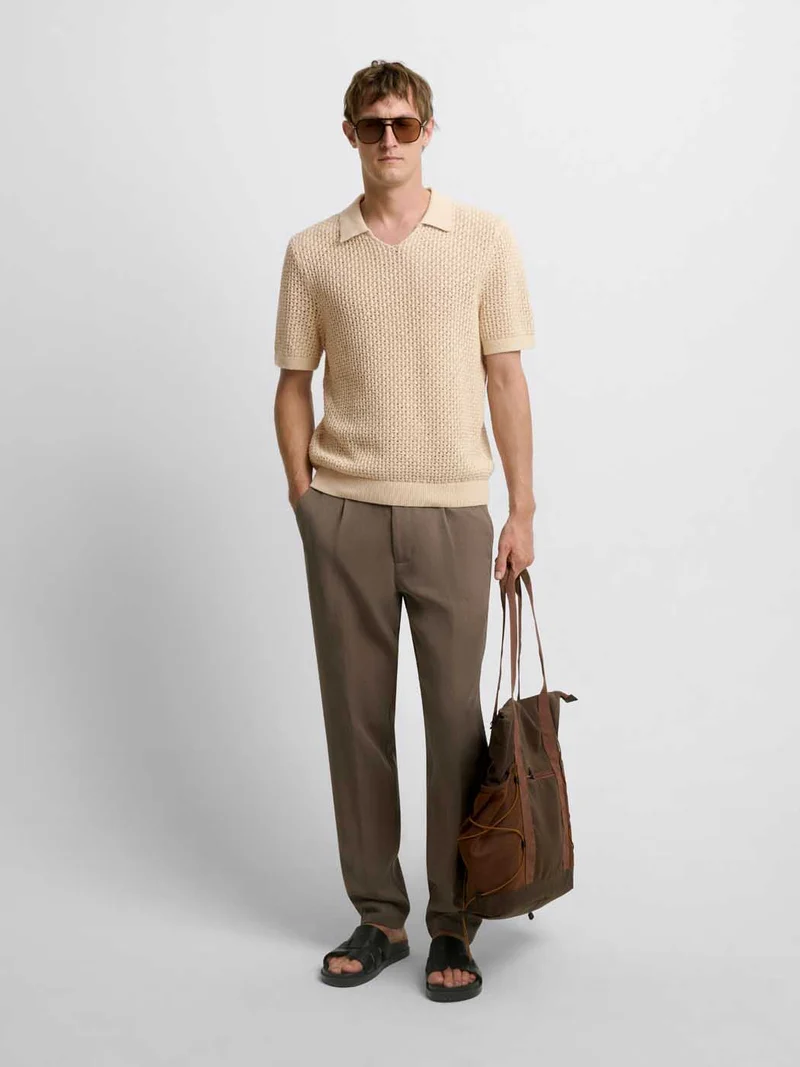 Polo maille col V ajouré