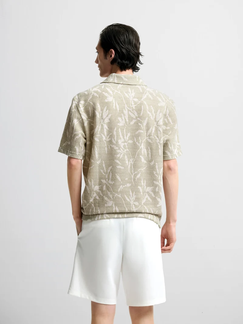 Polo col ouvert à motifs