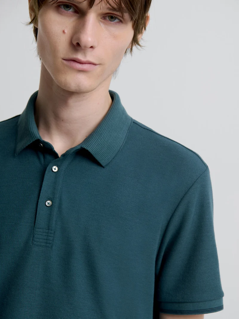 Polo col boutonné gauffré