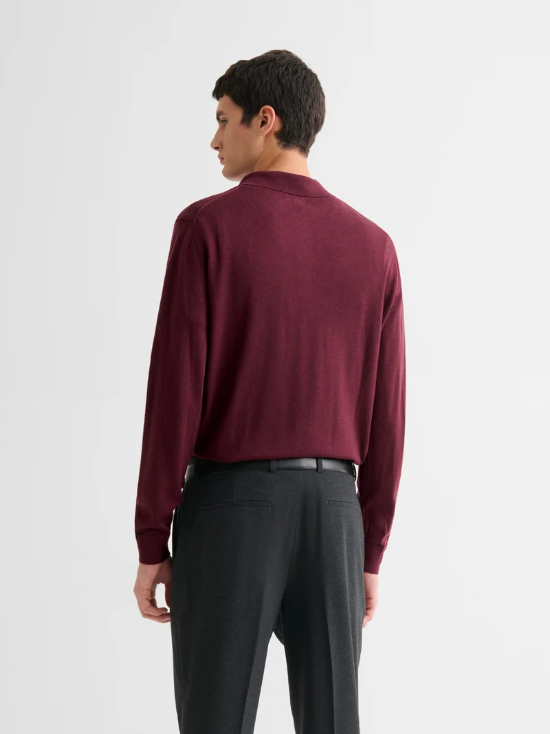 Polo boutonné en laine Mérinos