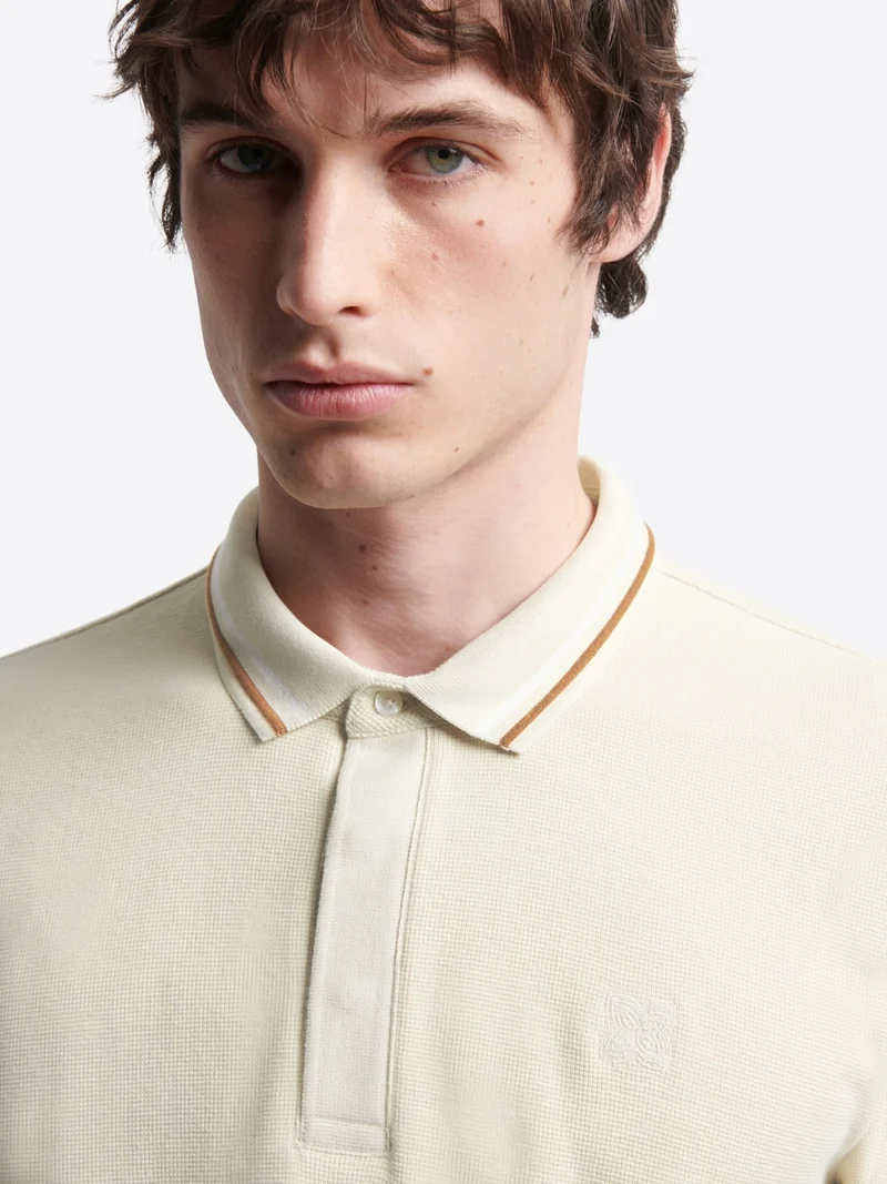 Polo manches longues en coton gaufré