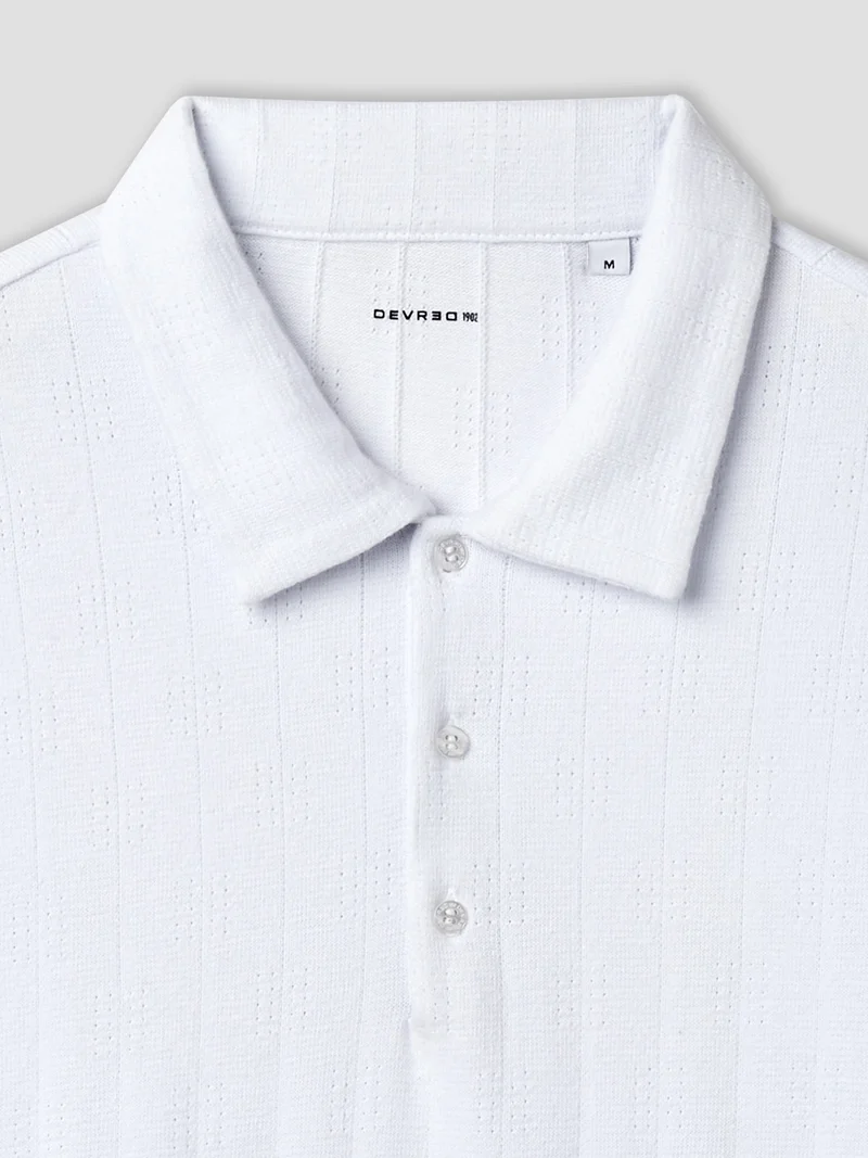 Polo col boutonné en maille rayée