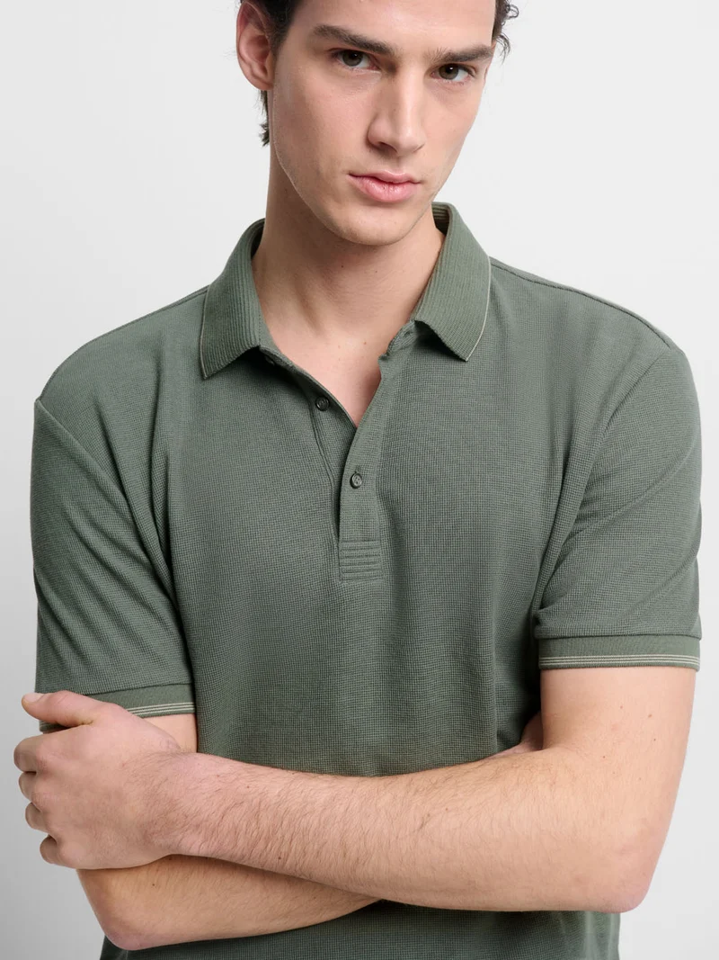 Polo col boutonné gauffré