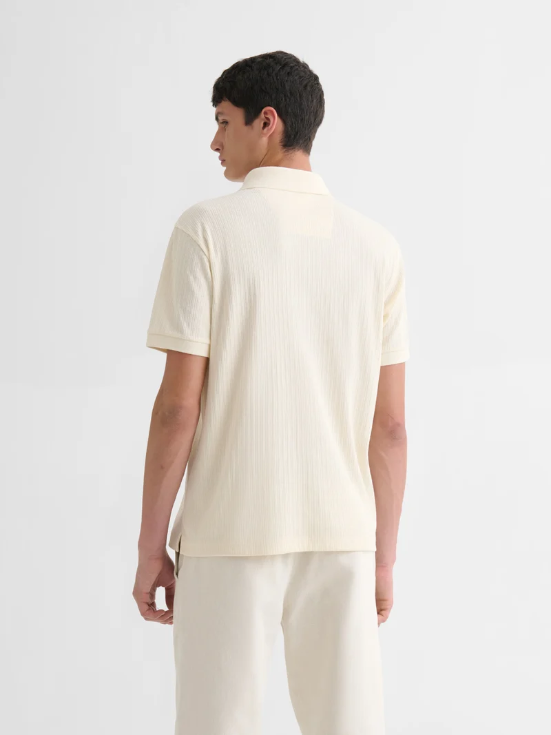 Polo col V effet maille