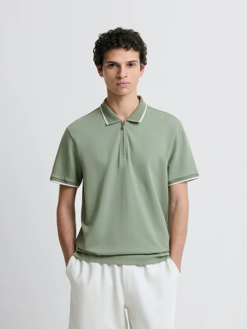 Polo zippé stretch