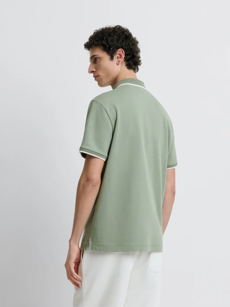 Polo zippé stretch