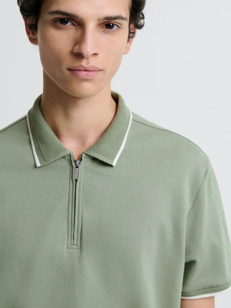 Polo zippé stretch