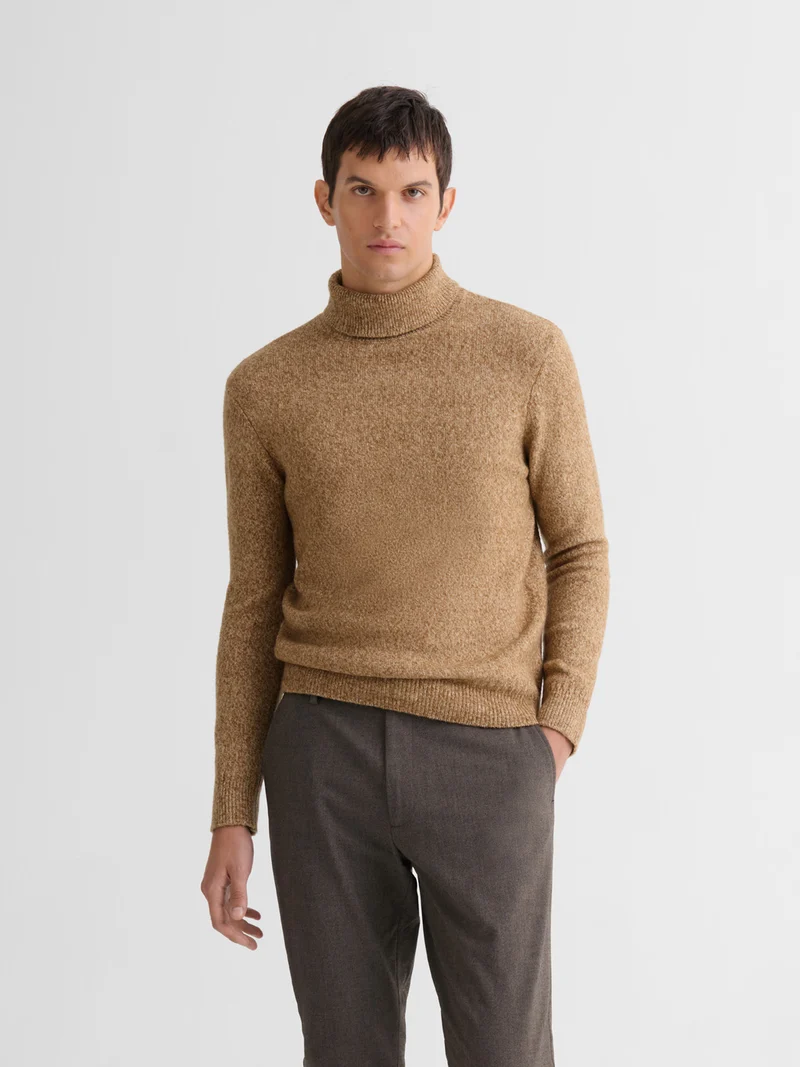 Pull col roulé jersey chiné