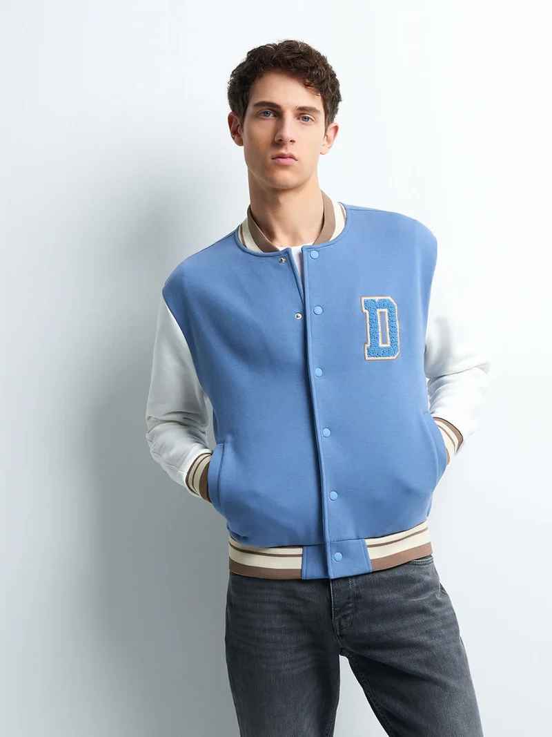 Blouson col teddy bicolore
