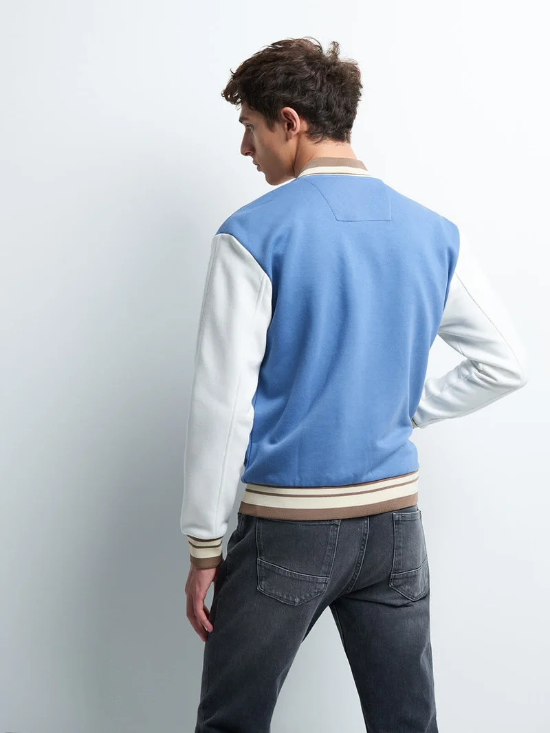 Blouson col teddy bicolore