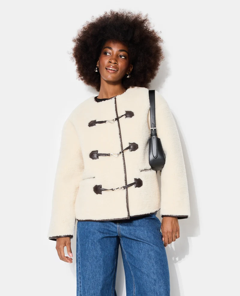 Blouson droit en sherpa avec attaches mousqueton