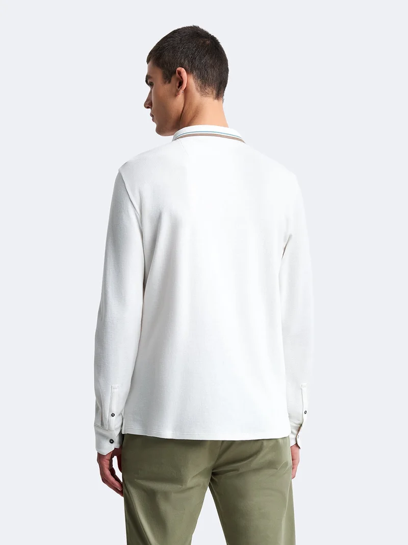 Polo manches longues en coton brodé