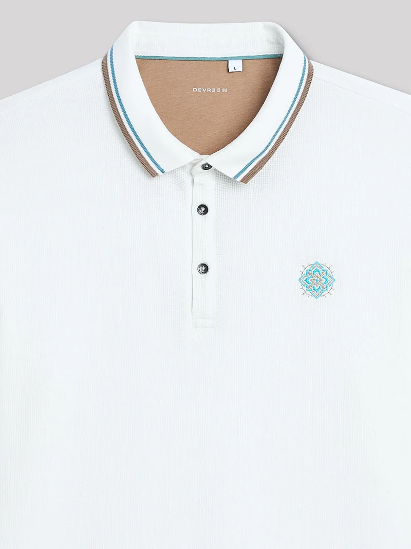 Polo manches longues en coton brodé