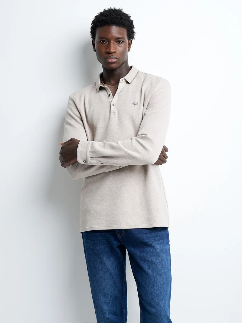 Polo manches longues en coton brodé