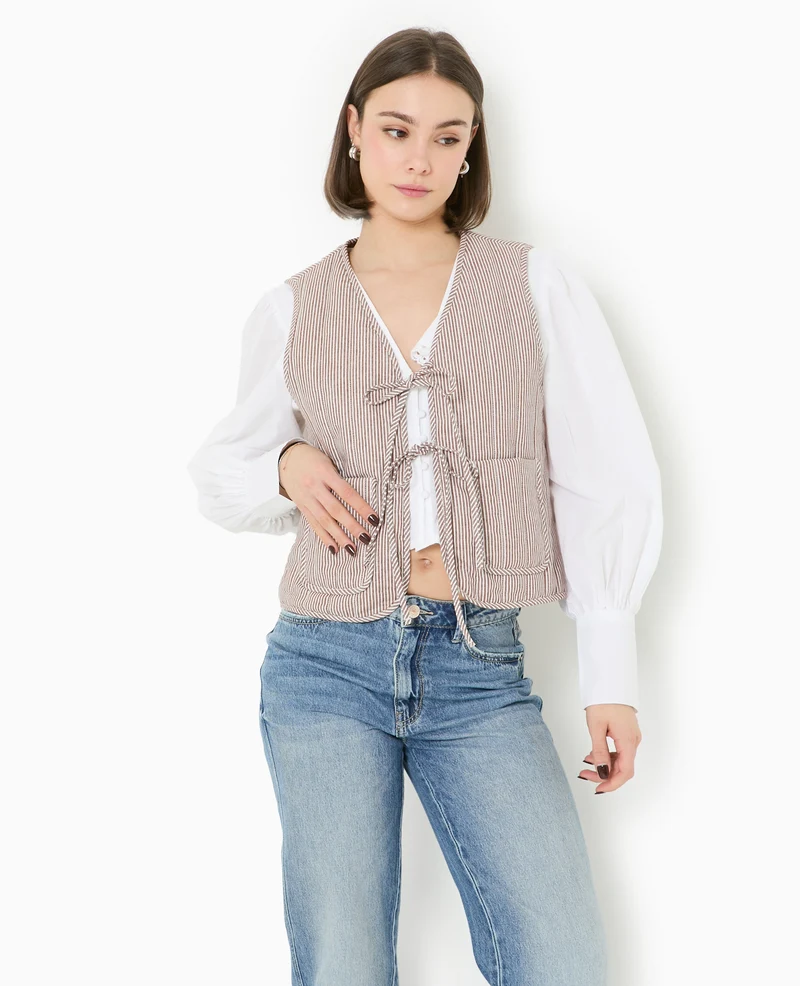 Veste sans manches matelassée avec rayures